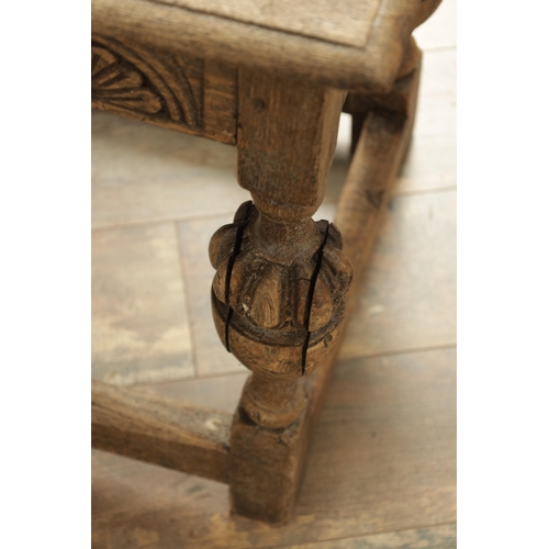 1227 - A 17TH CENTURY STYLE OAK LONG JOINT STOOL with an arcaded carved frieze above bulbous turned legs jo... 