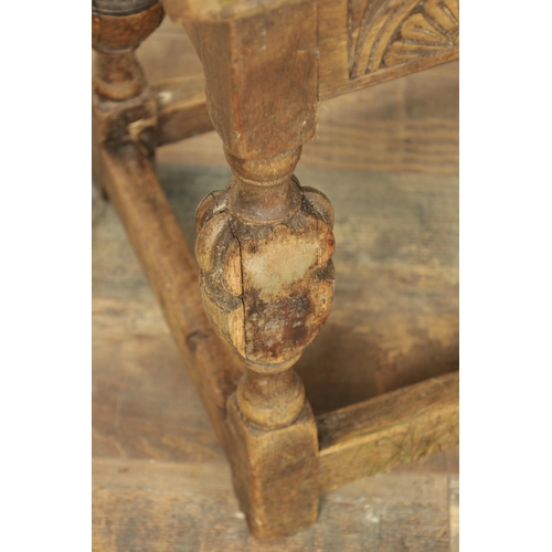 1227 - A 17TH CENTURY STYLE OAK LONG JOINT STOOL with an arcaded carved frieze above bulbous turned legs jo... 