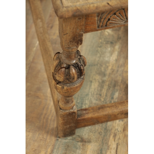 1227 - A 17TH CENTURY STYLE OAK LONG JOINT STOOL with an arcaded carved frieze above bulbous turned legs jo... 