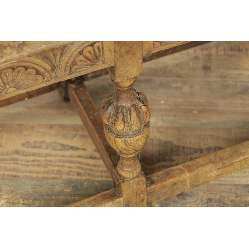 1227 - A 17TH CENTURY STYLE OAK LONG JOINT STOOL with an arcaded carved frieze above bulbous turned legs jo... 