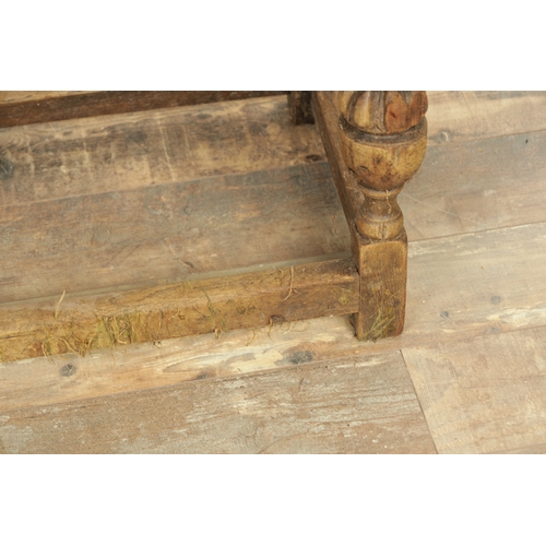 1227 - A 17TH CENTURY STYLE OAK LONG JOINT STOOL with an arcaded carved frieze above bulbous turned legs jo... 