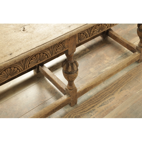 1227 - A 17TH CENTURY STYLE OAK LONG JOINT STOOL with an arcaded carved frieze above bulbous turned legs jo... 