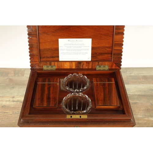 1228 - A LATE REGENCY SABICU WOOD TEAPOY IN THE MANNER OF GILLOWS with a gadrooned hinged top revealing a f... 