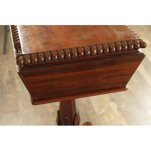 1228 - A LATE REGENCY SABICU WOOD TEAPOY IN THE MANNER OF GILLOWS with a gadrooned hinged top revealing a f... 