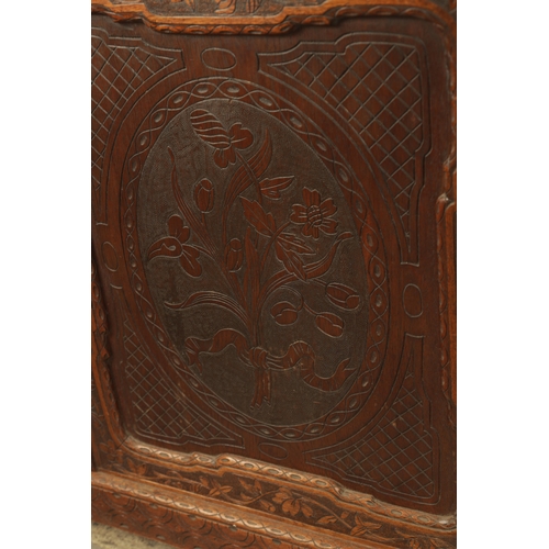 1232 - A 19TH CENTURY CARVED WALNUT BLACK FOREST DISPLAY CABINET OF SMALL SIZE with hinged glazed doors hav... 