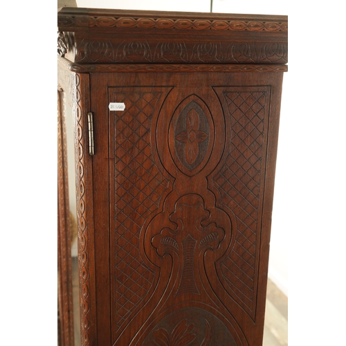 1232 - A 19TH CENTURY CARVED WALNUT BLACK FOREST DISPLAY CABINET OF SMALL SIZE with hinged glazed doors hav... 