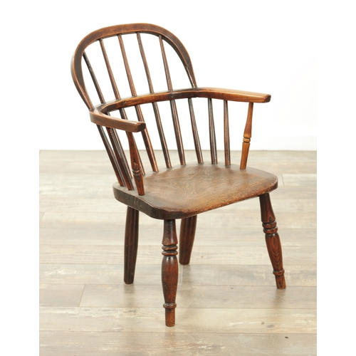 1233 - A 19TH CENTURY CHILD'S STICK-BACK WINDSOR CHAIR having an elm seat and ring-turned legs. (57cm high,... 