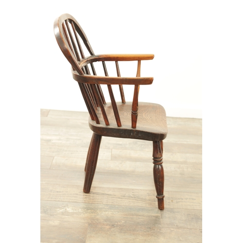 1233 - A 19TH CENTURY CHILD'S STICK-BACK WINDSOR CHAIR having an elm seat and ring-turned legs. (57cm high,... 