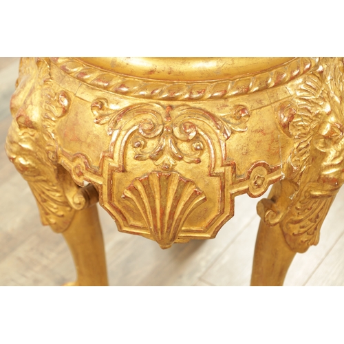 1234 - AN 18TH CENTURY CARVED GILTWOOD JARDINIERE STAND with lion head and shell carved frieze raised on pa... 