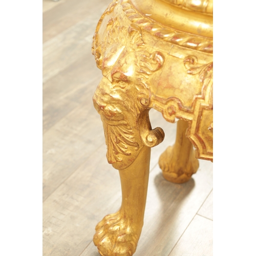 1234 - AN 18TH CENTURY CARVED GILTWOOD JARDINIERE STAND with lion head and shell carved frieze raised on pa... 