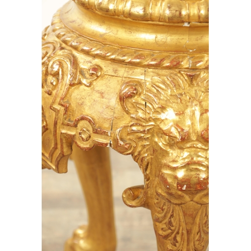 1234 - AN 18TH CENTURY CARVED GILTWOOD JARDINIERE STAND with lion head and shell carved frieze raised on pa... 