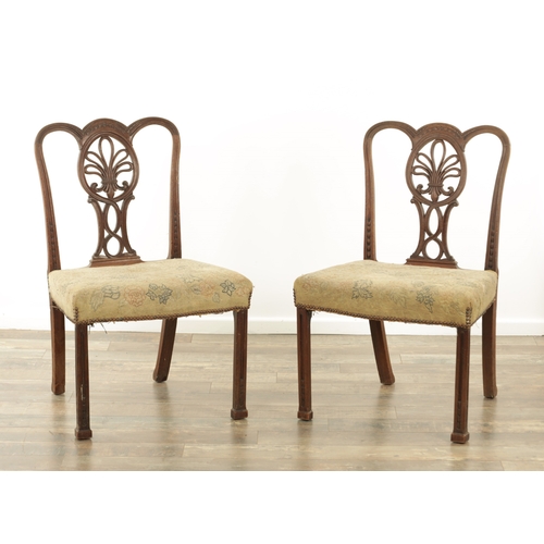 1235 - AN UNUSUAL PAIR OF GEORGE III MAHOGANY SIDE CHAIRS IN THE MANNER OF THOMAS CHIPPENDALE with unusual ... 