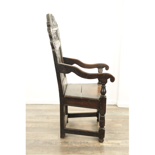 1237 - A GOOD LATE 17TH CENTURY JOINED OAK WAINSCOT CHAIR with scrolled leaf-carved crest and matching ears... 