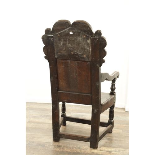 1237 - A GOOD LATE 17TH CENTURY JOINED OAK WAINSCOT CHAIR with scrolled leaf-carved crest and matching ears... 