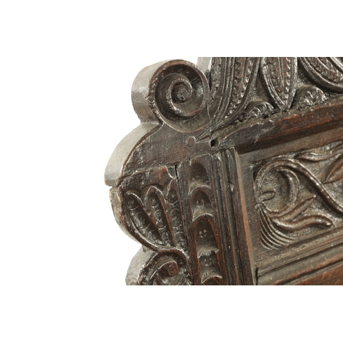 1237 - A GOOD LATE 17TH CENTURY JOINED OAK WAINSCOT CHAIR with scrolled leaf-carved crest and matching ears... 