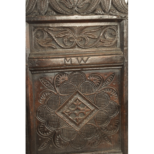 1237 - A GOOD LATE 17TH CENTURY JOINED OAK WAINSCOT CHAIR with scrolled leaf-carved crest and matching ears... 