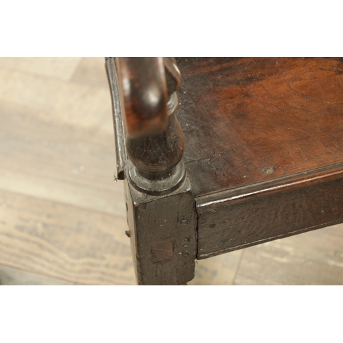 1237 - A GOOD LATE 17TH CENTURY JOINED OAK WAINSCOT CHAIR with scrolled leaf-carved crest and matching ears... 