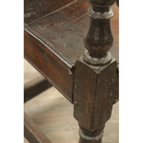 1237 - A GOOD LATE 17TH CENTURY JOINED OAK WAINSCOT CHAIR with scrolled leaf-carved crest and matching ears... 