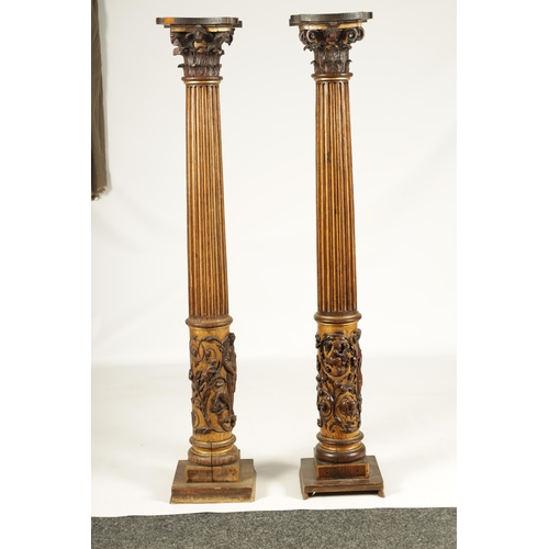 1238 - A PAIR OF 19TH CENTURY OAK AND GILT HIGH-LIGHTED CARVED CORINTHIAN COLUMNS the lower bodies with con... 