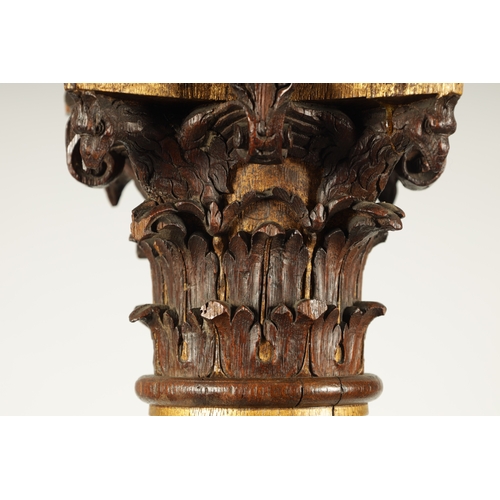 1238 - A PAIR OF 19TH CENTURY OAK AND GILT HIGH-LIGHTED CARVED CORINTHIAN COLUMNS the lower bodies with con... 