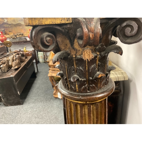 1238 - A PAIR OF 19TH CENTURY OAK AND GILT HIGH-LIGHTED CARVED CORINTHIAN COLUMNS the lower bodies with con... 