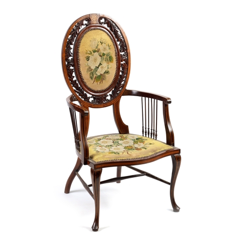 1239 - AN EDWARDIAN INLAID ROSEWOOD ARMCHAIR WITH TAPESTRY UPHOLSTERY the raised oval back with leaf carved... 