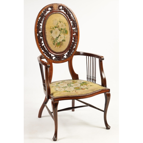 1239 - AN EDWARDIAN INLAID ROSEWOOD ARMCHAIR WITH TAPESTRY UPHOLSTERY the raised oval back with leaf carved... 