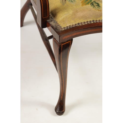 1239 - AN EDWARDIAN INLAID ROSEWOOD ARMCHAIR WITH TAPESTRY UPHOLSTERY the raised oval back with leaf carved... 