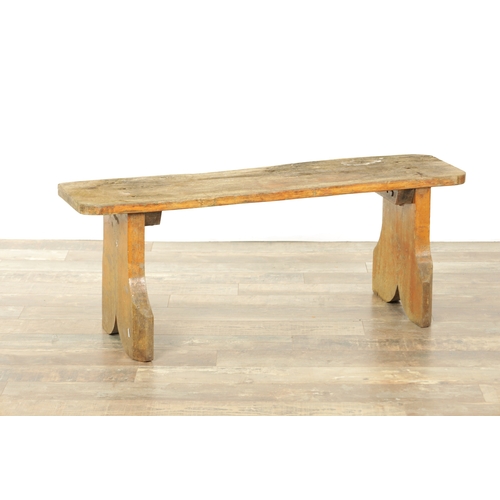 1240 - A PAIR OF 20TH CENTURY OAK BENCHES with shaped plank tops and end supports. (123cm wide 46cm high )