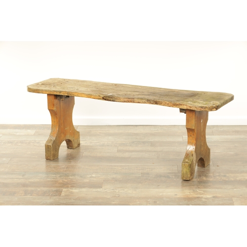 1240 - A PAIR OF 20TH CENTURY OAK BENCHES with shaped plank tops and end supports. (123cm wide 46cm high )