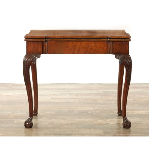 1245 - A GOOD GEORGE II MAHOGANY CARD TABLE the baize lined fold-over top with outset corners above a friez... 