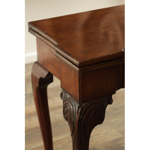 1245 - A GOOD GEORGE II MAHOGANY CARD TABLE the baize lined fold-over top with outset corners above a friez... 