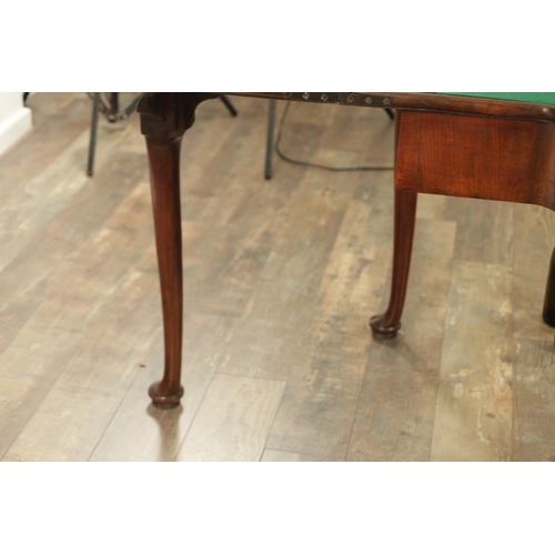 1245 - A GOOD GEORGE II MAHOGANY CARD TABLE the baize lined fold-over top with outset corners above a friez... 