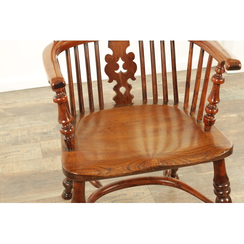 1247 - AN EARLY 19TH CENTURY NOTTINGHAMSHIRE YEW WOOD HIGH BACK WINDSOR CHAIR with hooped back and shaped p... 