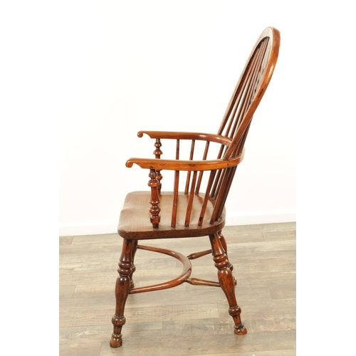 1247 - AN EARLY 19TH CENTURY NOTTINGHAMSHIRE YEW WOOD HIGH BACK WINDSOR CHAIR with hooped back and shaped p... 