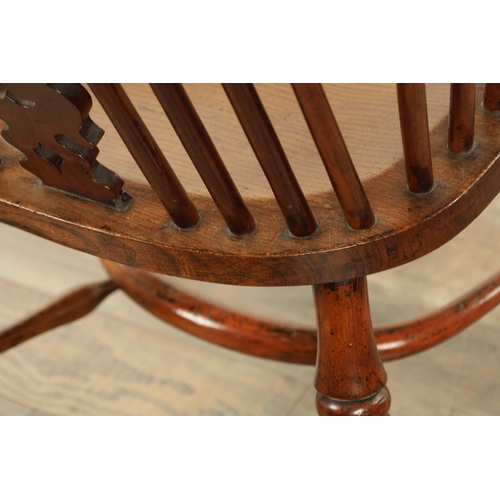 1247 - AN EARLY 19TH CENTURY NOTTINGHAMSHIRE YEW WOOD HIGH BACK WINDSOR CHAIR with hooped back and shaped p... 