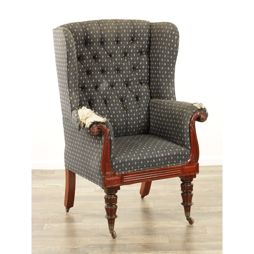 1248 - A LATE REGENCY MAHOGANY UPHOLSTERED LIBRARY CHAIR with a leaf-carved scrolled frame raised on turned... 