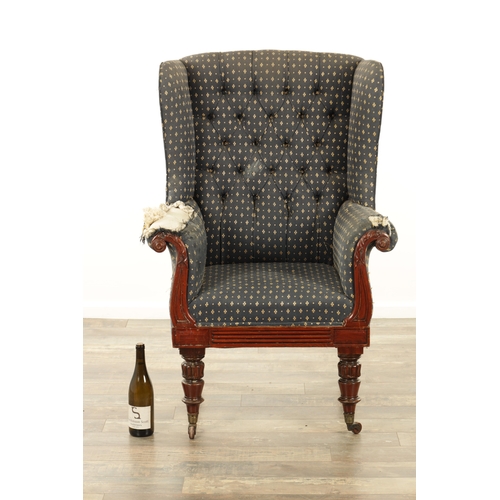 1248 - A LATE REGENCY MAHOGANY UPHOLSTERED LIBRARY CHAIR with a leaf-carved scrolled frame raised on turned... 