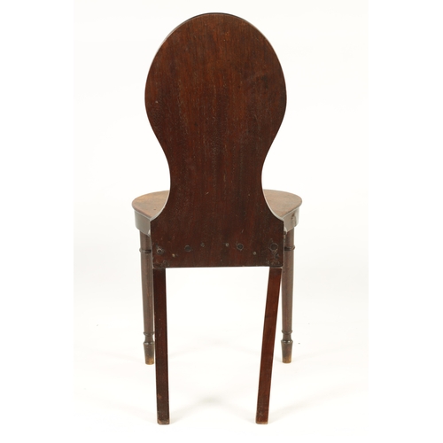 1250 - A GEORGE III MAHOGANY HALL CHAIR with painted crest (92cm high 42cm wide)