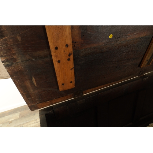 1251 - AN EARLY 18TH CENTURY JOINED OAK MULE CHEST with hinged top and three fielded panels to the front ab... 