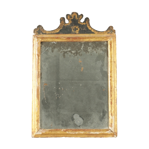 1252 - A LATE 17TH CENTURY GILT MOULDED AND LACQUERED MIRROR having a shaped pediment above the original mi... 