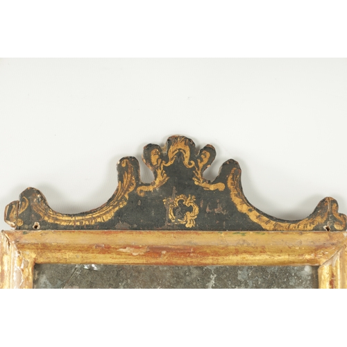 1252 - A LATE 17TH CENTURY GILT MOULDED AND LACQUERED MIRROR having a shaped pediment above the original mi... 