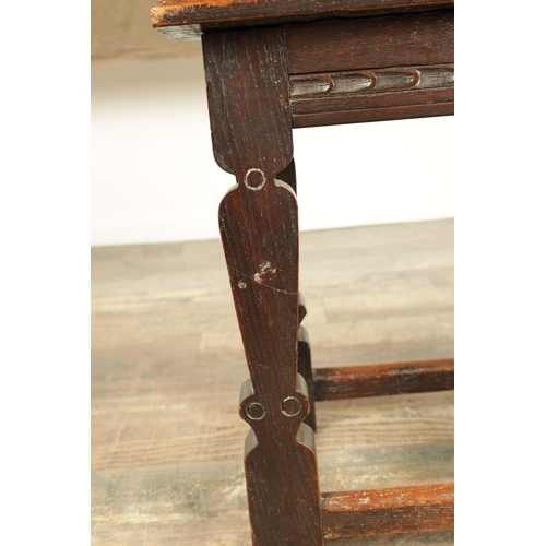 1253 - A 17TH CENTURY STYLE JOINED OAK JOINT STOOL with plank top and chip-carved frieze, raised on silhoue... 