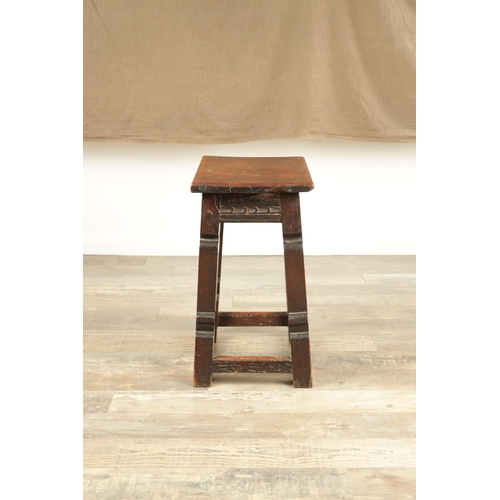 1253 - A 17TH CENTURY STYLE JOINED OAK JOINT STOOL with plank top and chip-carved frieze, raised on silhoue... 