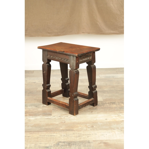 1253 - A 17TH CENTURY STYLE JOINED OAK JOINT STOOL with plank top and chip-carved frieze, raised on silhoue... 