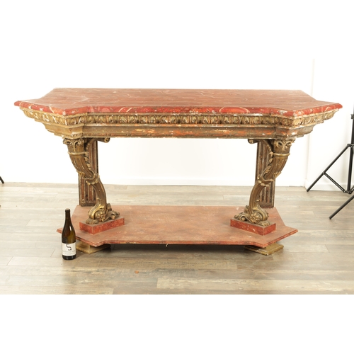 1256 - A STYLISH PAIR OF CARVED GILTWOOD AND SCUMBLED MARBLE CONSOLE TABLES having outset corners raised on... 