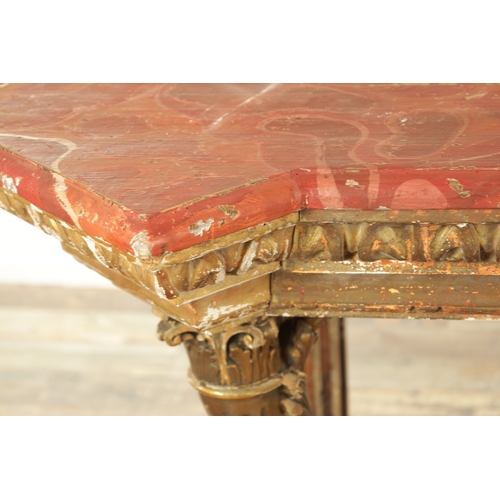 1256 - A STYLISH PAIR OF CARVED GILTWOOD AND SCUMBLED MARBLE CONSOLE TABLES having outset corners raised on... 