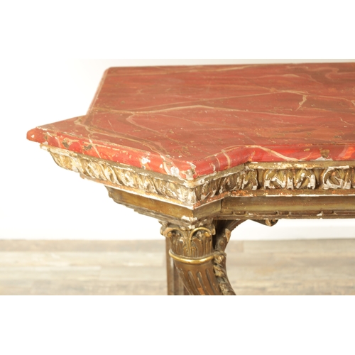 1256 - A STYLISH PAIR OF CARVED GILTWOOD AND SCUMBLED MARBLE CONSOLE TABLES having outset corners raised on... 