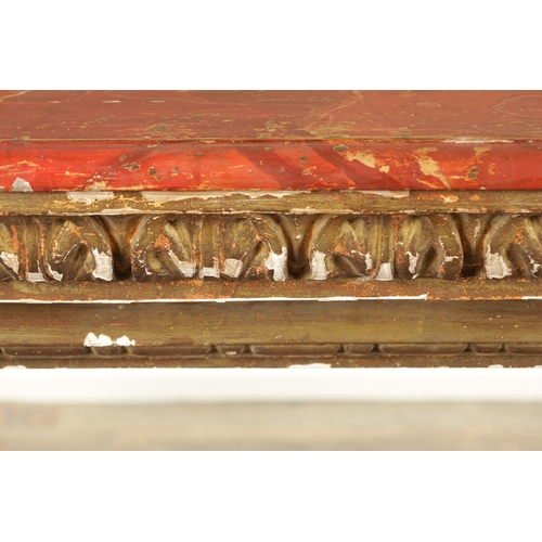 1256 - A STYLISH PAIR OF CARVED GILTWOOD AND SCUMBLED MARBLE CONSOLE TABLES having outset corners raised on... 