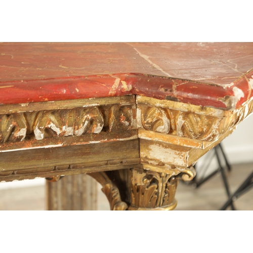 1256 - A STYLISH PAIR OF CARVED GILTWOOD AND SCUMBLED MARBLE CONSOLE TABLES having outset corners raised on... 